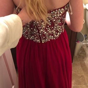 Red Sweetheart neckline bejeweled top flowwy bottom prom dress